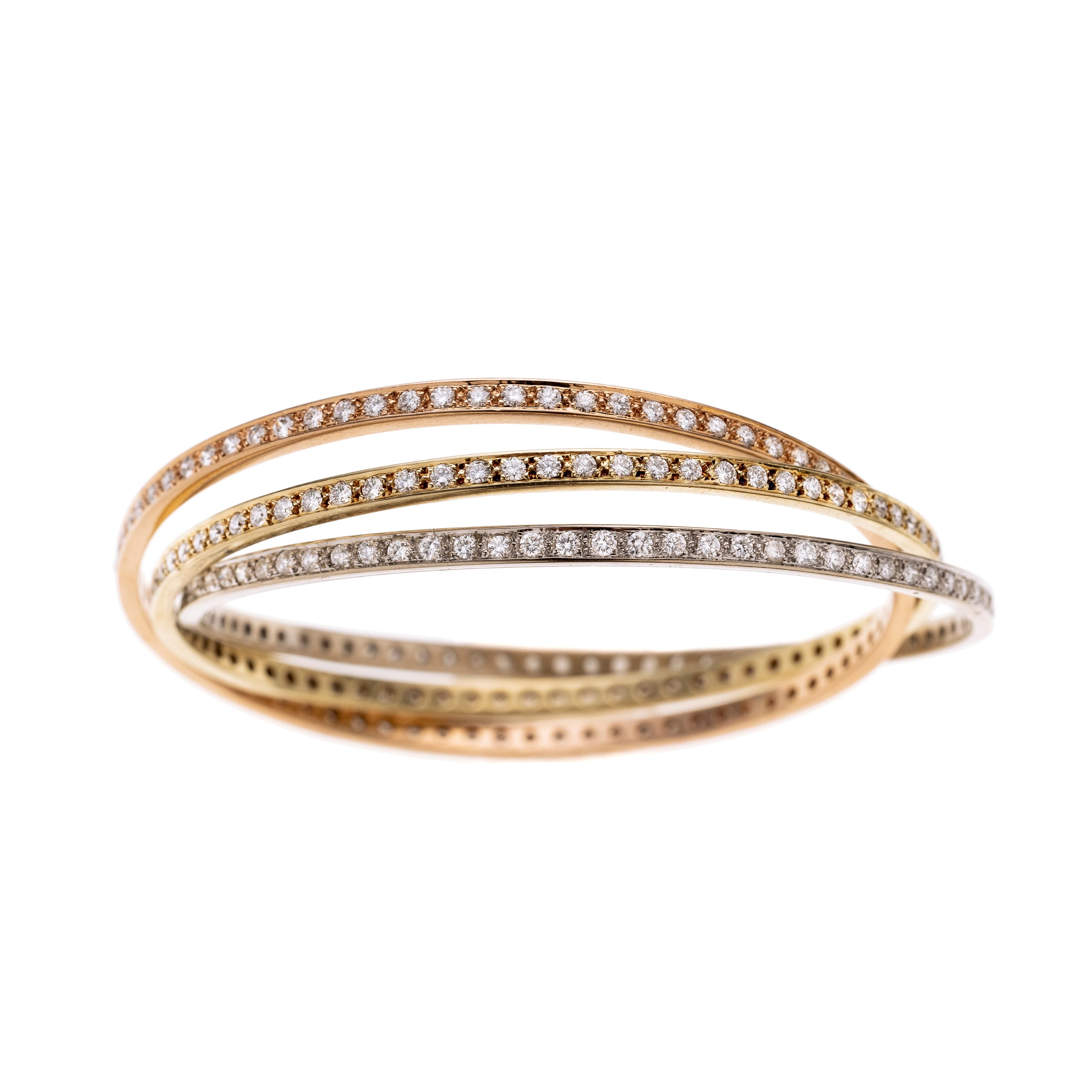 Ein Dreierreif  tricolor, besetzt mit insgesamt 225 Diamanten je ca. 0.02 ct