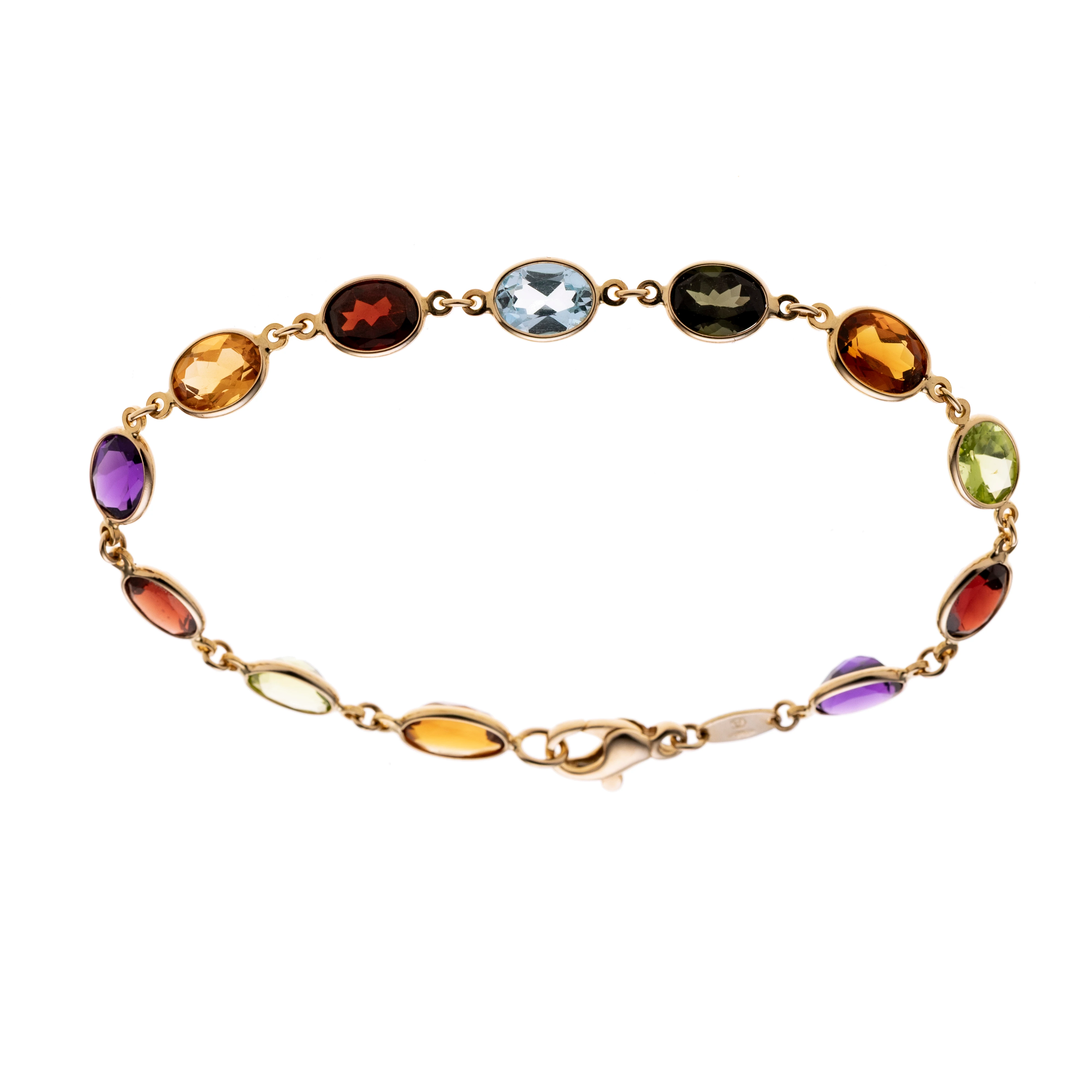 12 Glieder aus bunten Facettierten, ovalen Quarzen, Granat, Turmalin, Peridot und Aquamarinen in Brillenfassungen. Signiert "CA".